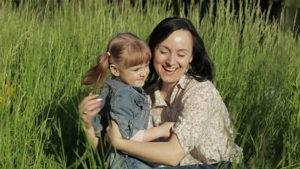 Family in Park Takes Off Medical Masks After Coronavirus Pandemic Quarantine End