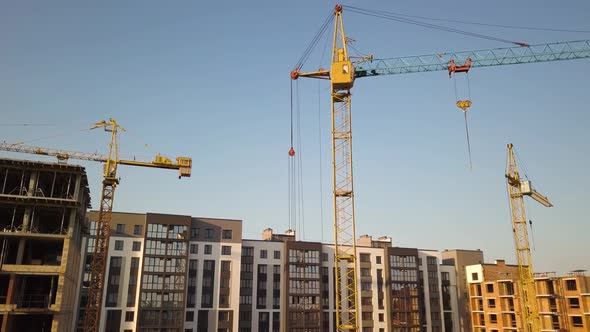 Aerial view of tall residential apartment buildings under construction.