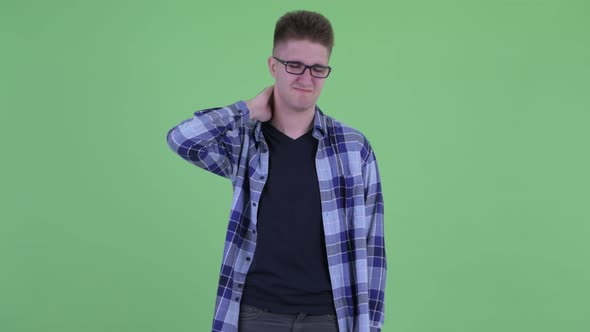 Stressed Young Hipster Man Having Neck Pain