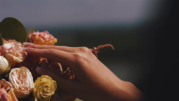 Lady with Stylish Manicure Touches Rose Flowers Close View