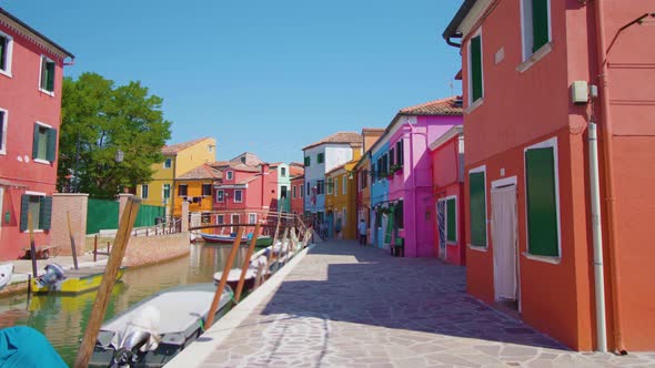 Rows of Colored Houses Along Burano Water Channel in Morning