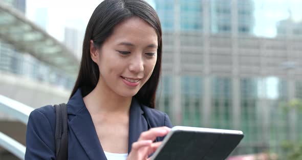 Businesswoman look at the digital tablet computer