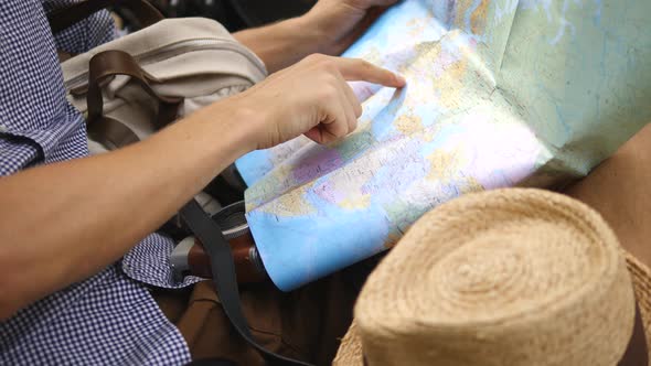 Travel Concept. Hand Of Traveler Pointing On City Map.