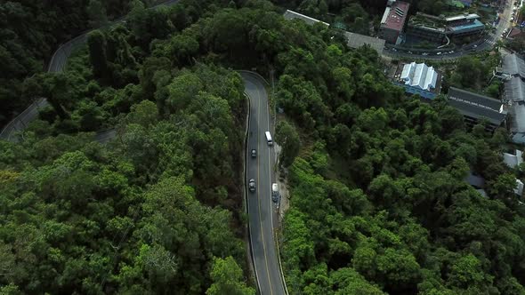 Aerial view of serpentine road crossing tropical forest, Ko Chang, Thailand.