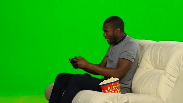 Man Won in the Game on the Console and Happy. Green Screen