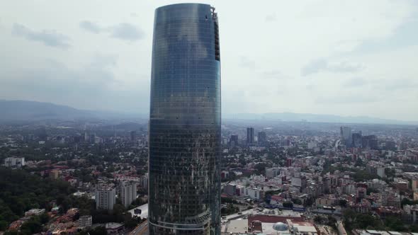 Aerial Rising View Of Centro Comercial Mítikah In Benito Juárez Borough. Tilt Down