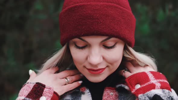 Portrait of Young Pretty Woman in Forest Winter Season