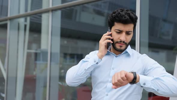 Business Man Talking On Phone Near Office Outdoors