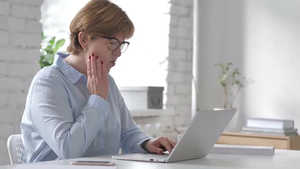 Toothache Old Woman with Tooth Pain at Work