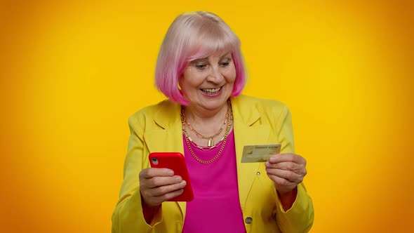 Senior Old Stylish Granny Woman Using Credit Bank Card and Smartphone Purchases Online Shopping