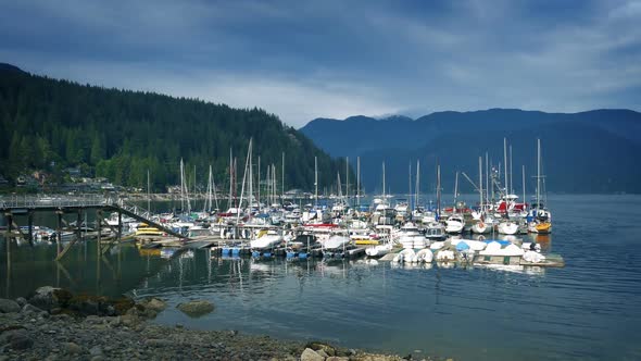 Boats Moored In Lake On Sunny Day