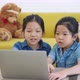 Two Asian girls studying online from home internet, Home Study, Social Distancing, E-learning. - VideoHive Item for Sale