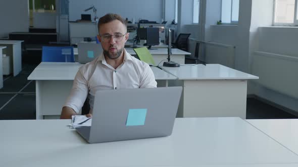 Happy Man Raises Hands and Starts to Throw Up White Paper