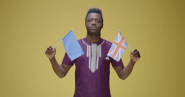 Eurosceptic Man Holding British and EU Flag