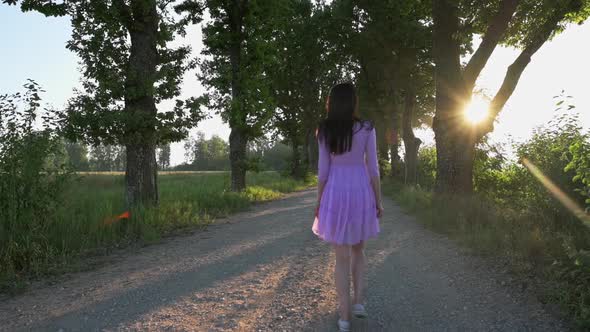 Woman Walking on Road