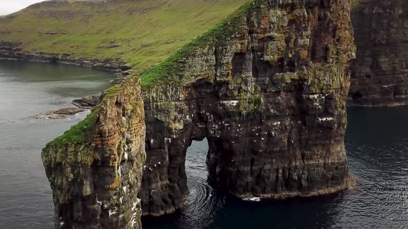 Aerial Drone View on Drangarnir Sea Stack in the Atlantic Ocean Faroe Islands