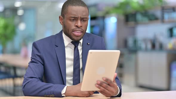 African Businessman Doing Video Call on Tablet