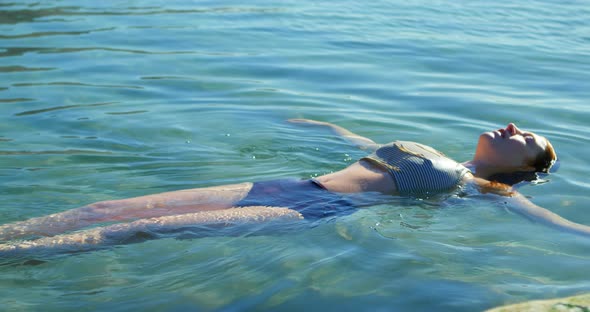 Woman swimming in the water at beach