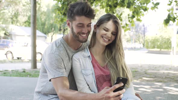 Couple taking selfie with smartphone