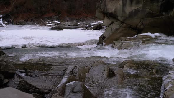 Waterfall Prut in the Winter. Rapid Flow of Water From a Mountain Creek and Stone Rapids with Snow