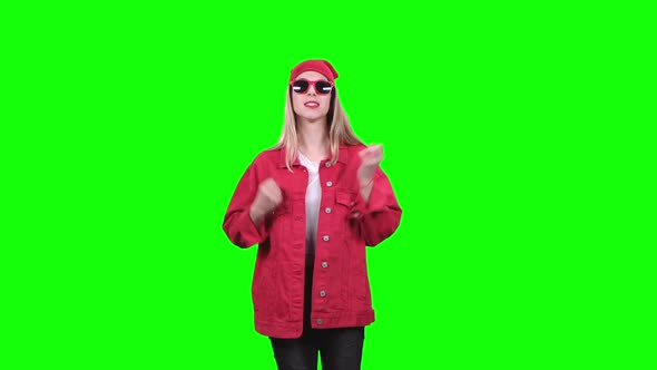 Girl in Stylish Clothes Worries About the Game of Her Team. Green Screen. Slow Motion