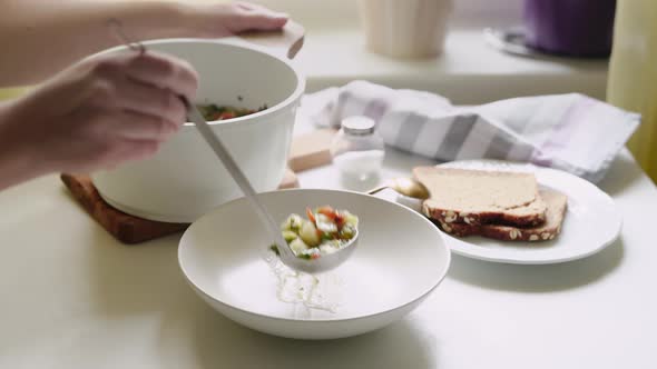 Healthy Vegetable Soup Minestrone Beeing Served on Dining Table