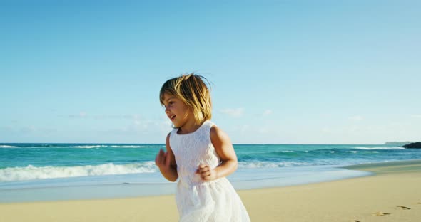 Father and Daughter Having Fun on the Beach