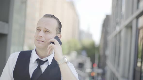 Businessman discussing work on cell phone