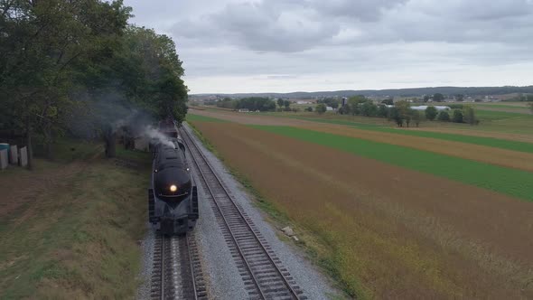 Head on Aerial View of a Steam Freight Train Steaming Up