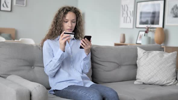 Excited Curly Hair Woman Successfully Shopping Online on Smartphone