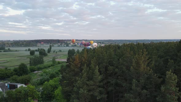 Aerial View of Hot Air Balloon Festival Take Off at Dawn in the Fog