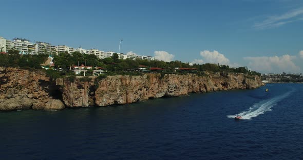 Helicopter Racing With Speed Boat Aerial View