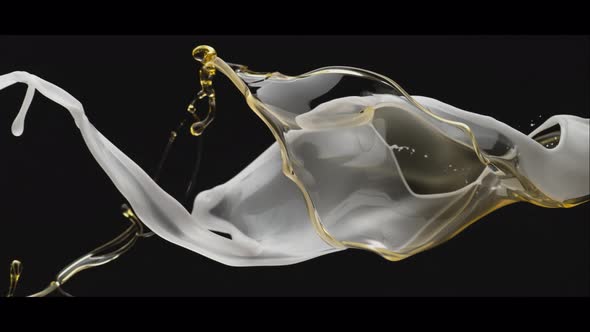 Milky liquid and oil twisting and falling. Slow Motion.