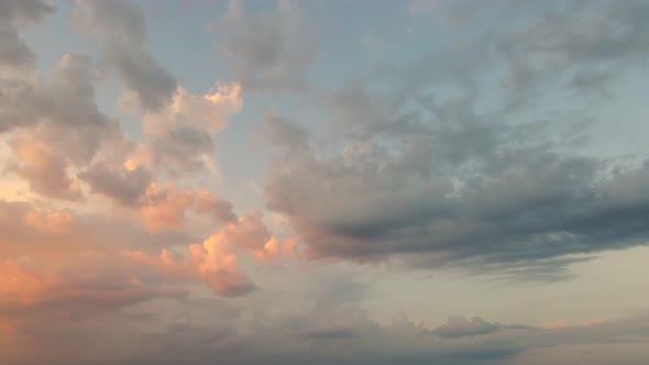 Beautiful Panorama of Blue Evening Sky with Orange Clouds in Sunlight