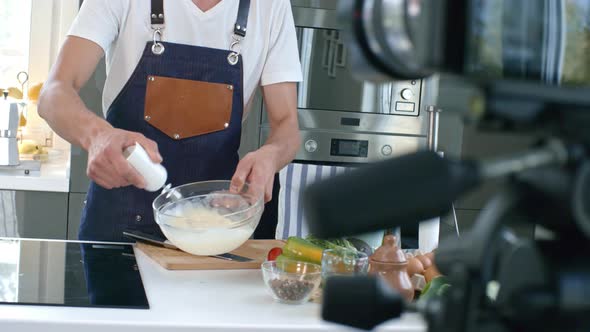 Cooking Show Presenter Whisking Mixture