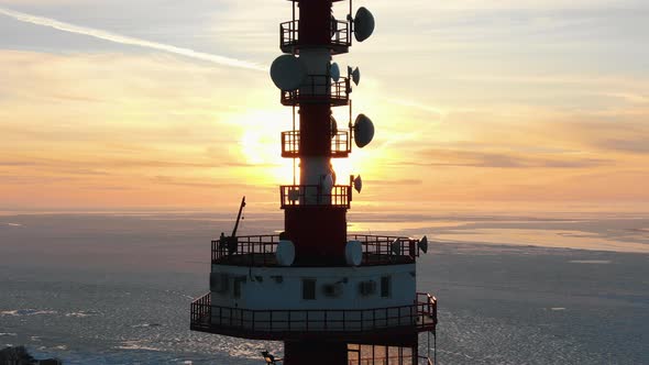 Top of Communication Tower Against Sunrise in Winter