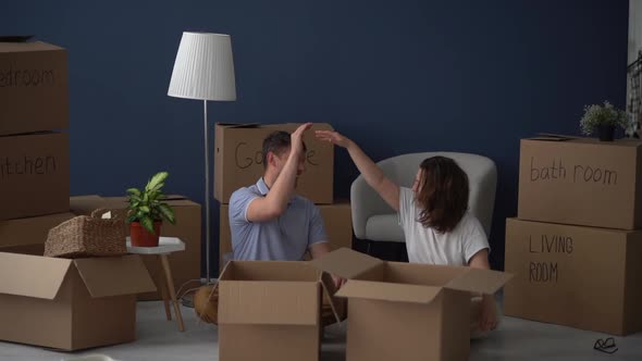 Husband and Wife Finish Packing for the Move