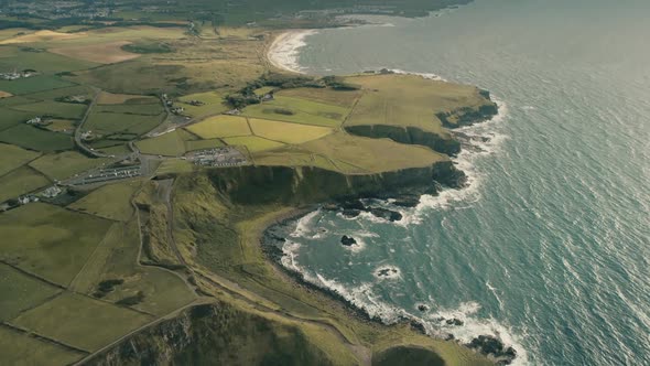 Ireland Rural Lands Aerial: Ocean Cliff Shoreline with Wide Green Grass Fields, Vales, Meadows