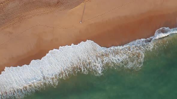 Aerial view of Praia dos Salgados with one person walking at the beach