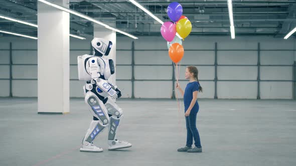 Little Girl Gifts Balloons To a Robot, Side View. School Kid, Education, Science Class Concept.