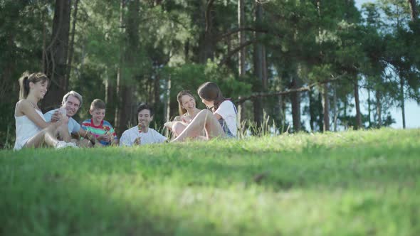 Family and friends having picnic together