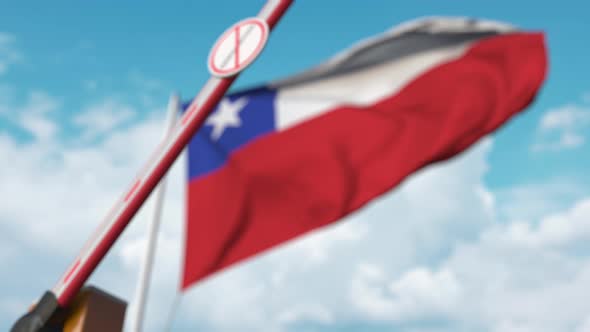 Barrier Gate with No Immigration Sign Closed at Flag of Chile alt