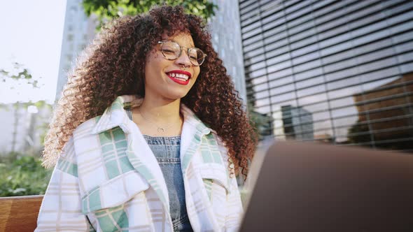 Young African American Woman is Having Online Meeting Using Her Laptop Businesswoman with Digital