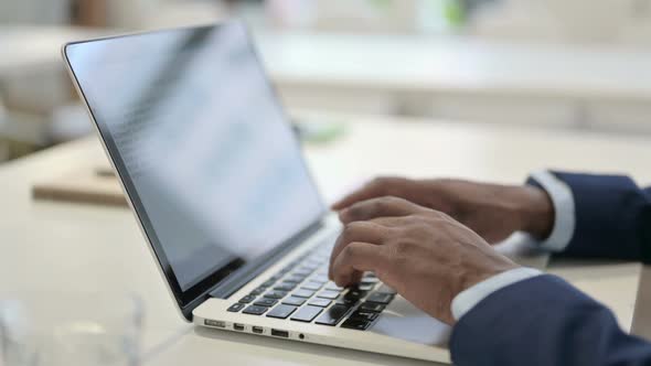 Side View of Hands of Businessman Typing on Laptop Close Up