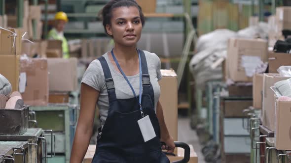 Female Warehouse Worker with Trolley