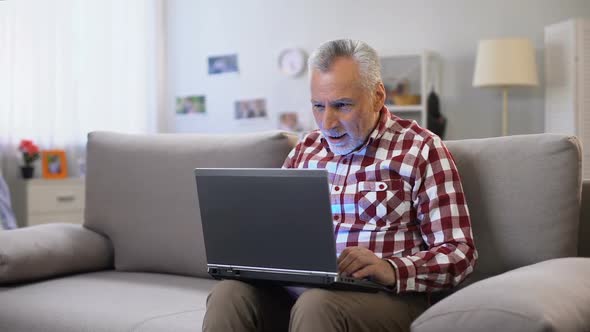 Cheerful Elderly Man Receiving Answer on Dating Site, Receiving Good News