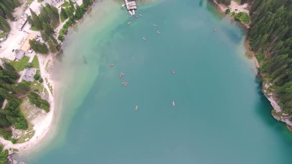 Aerial shot of boats on Lago di Braies (Pragser Wildsee lake), Dolomites, Italy