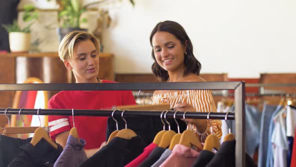 Women Choosing Clothes at Vintage Clothing Store