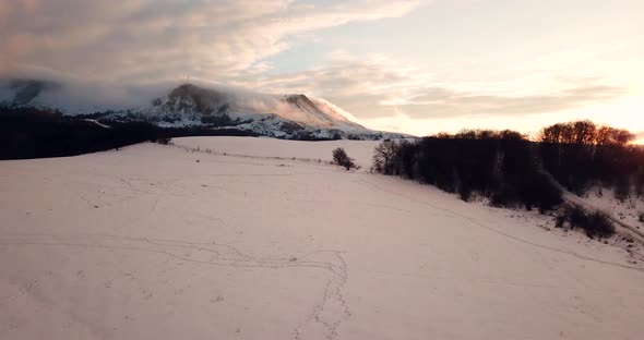 Epic Aerial Flight Near Mountain Clouds Towards Sunrise. Picturesque and Gorgeous Scene