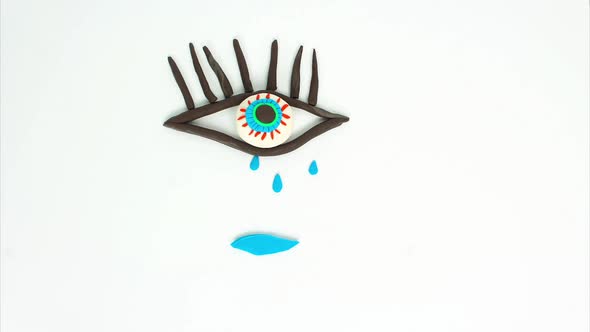 Interesting Plasticine Animation of a Sakura Branch Multicolored Eyes Falling Tears a Blue Creature